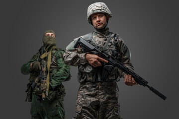 Photo of isolated on gray background nato and russia troop soldiers dressed in uniform.