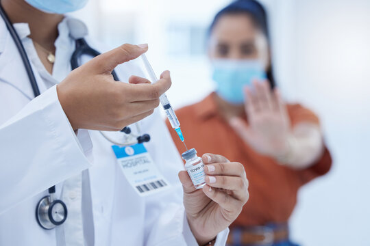 Doctor with covid vaccine, injection and corona medicine needle, bottle and syringe in hospital. Zoom in nurse hands, expert healthcare and flu risk, stop vaccination and reject medical treatment