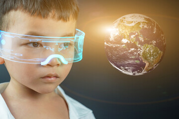 little boy looking at the world exploring the world learning. Elements of this image furnished by NASA