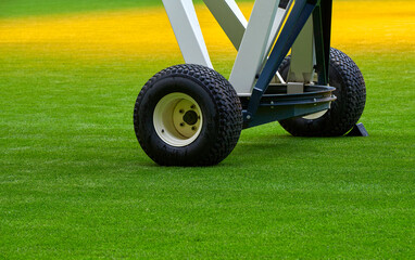 Fototapeta premium Grass caring modern equipment at the stadium 