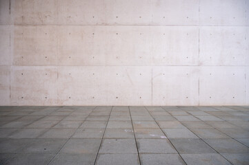 Hintergrund einer Betonwand und gepflasterten Boden