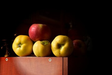 quinces and apples on the shelf