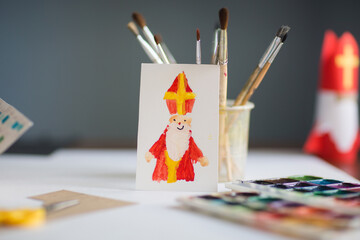 children's drawing - card for day of saint nicholas on table background for traditional Dutch...