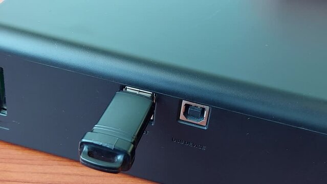 USB connector insert a flash drive or adapter for the phone cable.