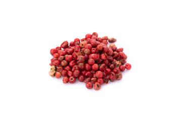 Pink peppercorns seeds isolated on white background.