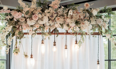 light bulbs and flowers in wedding decoration.