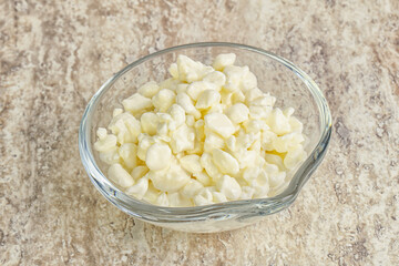 Grained cottage cheese in the bowl