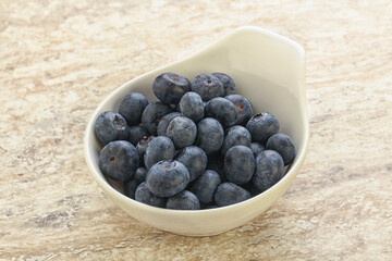 Sweet ripe blueberry heap in the bowl