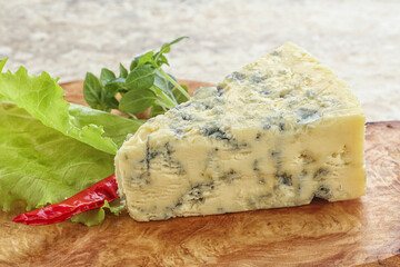 Blue cheese piece over board