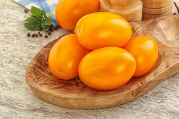 Sweet ripe yellow tomato in the bowl