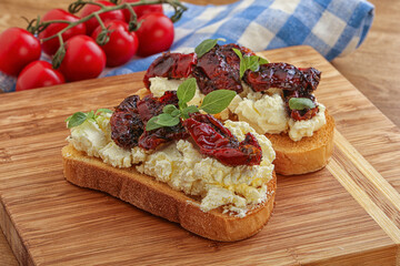 Bruschetta with soft cheese and tomato