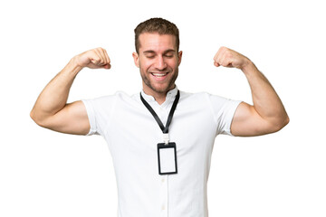 Fototapeta premium Young caucasian man with ID card isolated on green chroma background doing strong gesture
