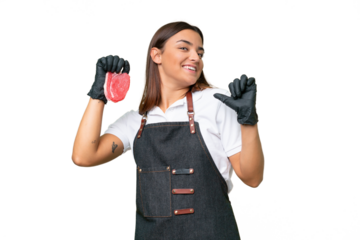 Butcher woman wearing an apron and serving fresh cut meat isolated on green chroma background proud and self-satisfied