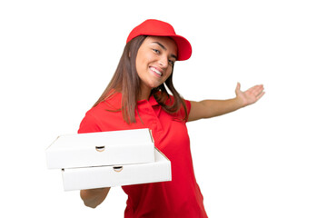 Pizza delivery caucasian woman with work uniform picking up pizza boxes isolated on green chroma...