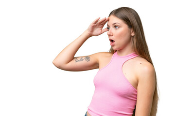 Young beautiful blonde woman over isolated background with surprise expression while looking side