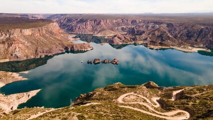 Aerial view of Atuel Canyon with cloudy sky reflection on the water, San Rafael, Mendoza, Argentina