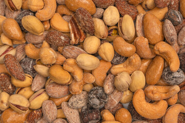  A group of almonds, pistachios, walnuts, macadamia, cashews.