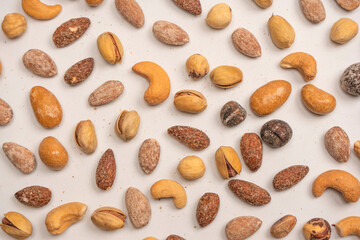  A group of almonds, pistachios, walnuts, macadamia, cashews.