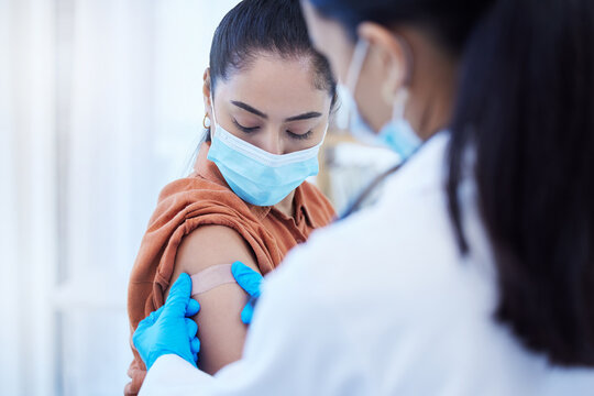 Covid Vaccine, Doctor And Patient With Face Mask For Safety, Compliance And Healthcare At A Hospital Or Clinic. Woman With Medical Worker Expert In Office Consultation For Corona Virus Medicine Help