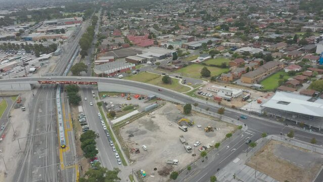 Aerial decent over active construction site following the main roads and arterials.