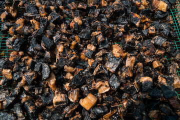 Drying thiwul under the hot sun, a traditional brown & black food from Gunung Kidul, Indonesia that comes from cassava tubers