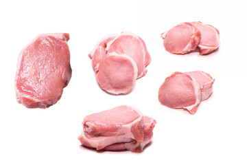 Raw pork pieces isolated on a white background.