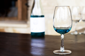 On the wooden table a glass of blue wine, tasting, Cyprus