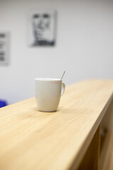 White porcelain glass on a wooden table.