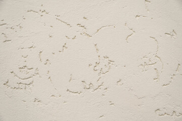 Abstract beige plaster background. Vintage pastel neutral background. Aged facade wall close-up. Textured background for website design layouts covers. Beautiful grunge pattern on the wall. Copy space