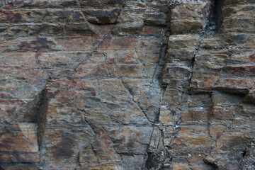 The texture of the stone rock in the mountains, the background, the texture of the mountain.