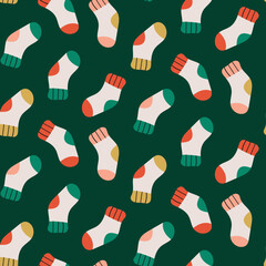 cute colourful socks Christmas winter seamless repeat pattern on green background