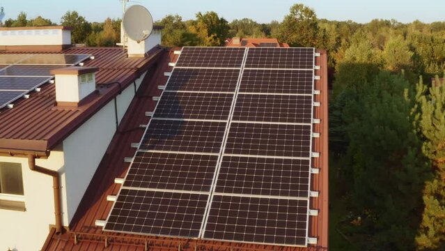 Solar panels are installed on the roof of a private house. Photovoltaics. The use of solar energy. Alternative renewable electric power industry.