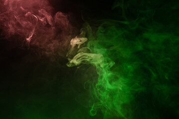 Obraz na płótnie Canvas Green and pink steam on a black background.