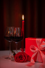romantic date concept red wine with glasses and candles