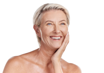 Beautiful mature caucasian woman posing topless and isolated against a pink background in a studio. Happy senior woman with glowing skin. Good skincare and a healthy routine is self care for your skin