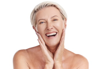 Portrait of a happy smiling mature caucasian woman looking positive and cheerful while posing topless in a studio against purple copyspace background. Older woman doing her skincare routine