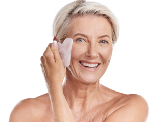 Studio Portrait of a mature woman woman using a gua sha stone for deep cell penetration against wrinkles. Happy older woman using anti ageing tool against purple copyspace background