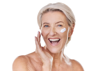 Portrait of one happy mature caucasian woman posing topless against a purple copyspace background. Ageing woman applying cream, moisturiser, sunblock during a skincare routine in a studio
