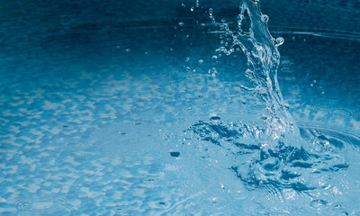 Water splash. Sparkling fresh blue water texture with a big splash. Freeze motion panorama banner with copyspace