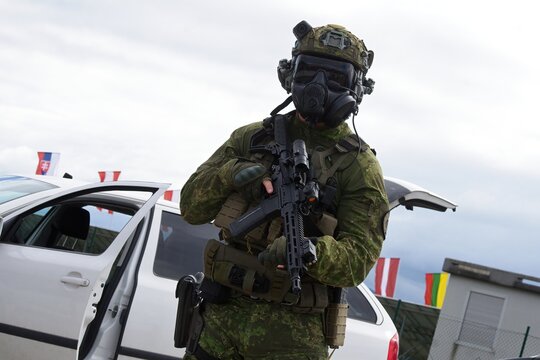 Special forces police officer with gun and gas mask
