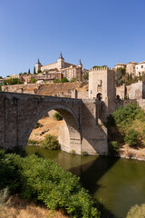 Fototapeta na wymiar Toledo Old Town and Bridge across Tagus River in Spain