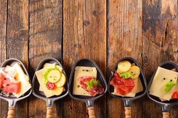 set of raclette cheese and ham
