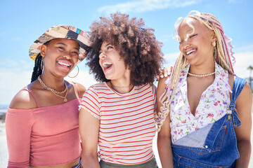 Beach, vacation and summer with a black woman and her friends enjoying a trip on the coast during their holiday. Travel, fun and a girl friend group outdoor together to relax while laughing or joking