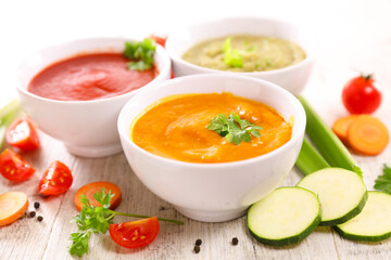 set of bowl of vegetable soup ( tomato, pumpkin, broccoli, carrot)