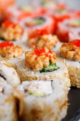 Traditional japanese sushi roll with tuna, tobiko red caviar and cucumber.