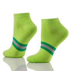 Close up of pair of sports cotton socks on invisible legs isolated on white background.