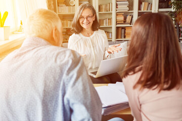 Senior counselor with a couple of seniors in a counseling session