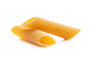 Uncooked whole grain pasta isolated on white background. Raw penne pasta.