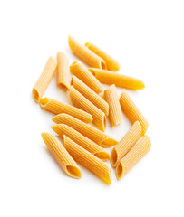 Uncooked whole grain pasta isolated on white background. Raw penne pasta.