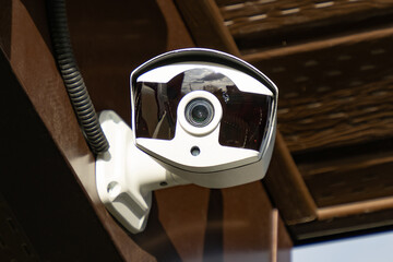 outdoor surveillance camera, fixed on the house